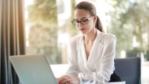 Small business owner comparing virtual assistant pricing models in 2026
